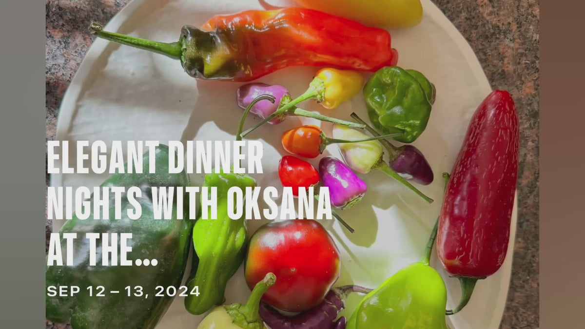 Load video: On farm dinner at Oksana's produce farm. Table set up, food, drinks and guests.